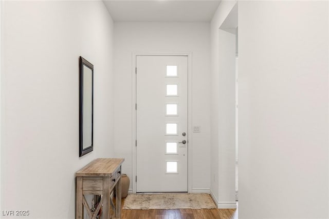 interior space with light wood-type flooring and baseboards