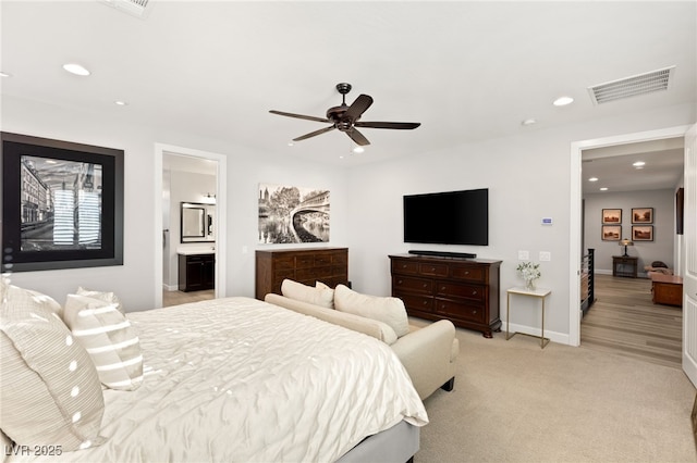 bedroom featuring baseboards, recessed lighting, visible vents, and light colored carpet