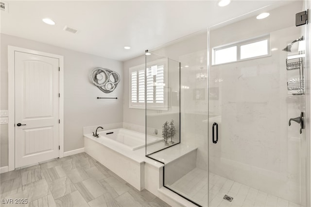 full bath with a wealth of natural light, visible vents, a shower stall, and a bath