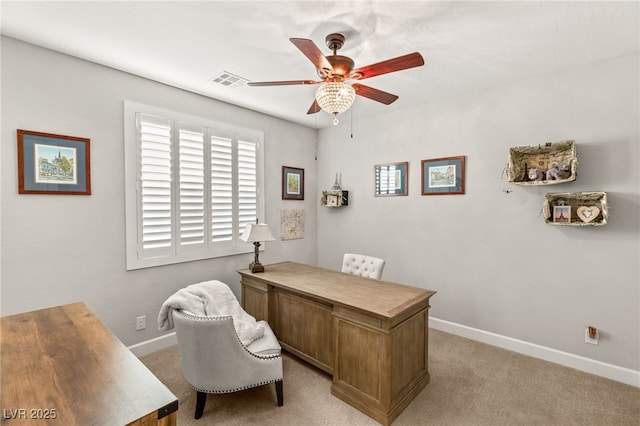 office area with light carpet, baseboards, visible vents, and a ceiling fan