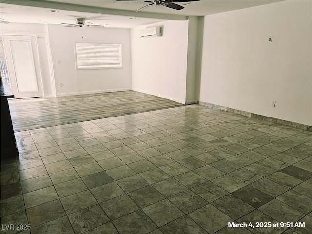 empty room featuring baseboards, a ceiling fan, and a wall mounted AC