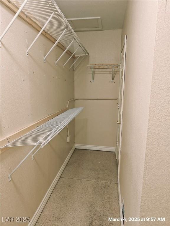 walk in closet with attic access