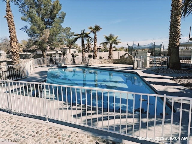 view of pool featuring a fenced in pool, fence, and a patio