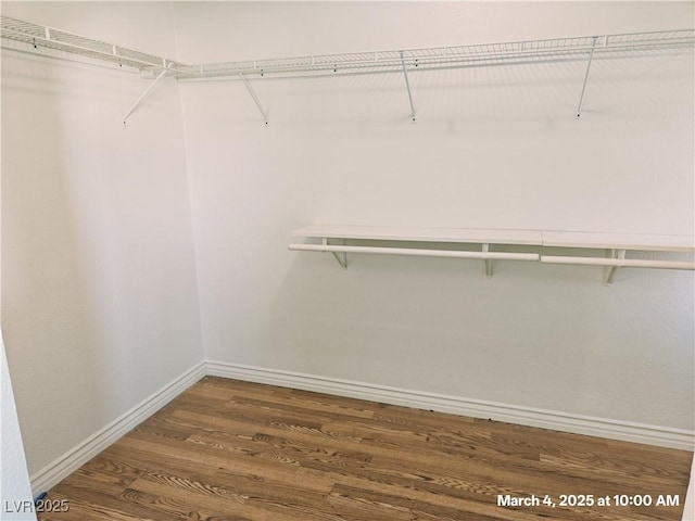 spacious closet with wood finished floors