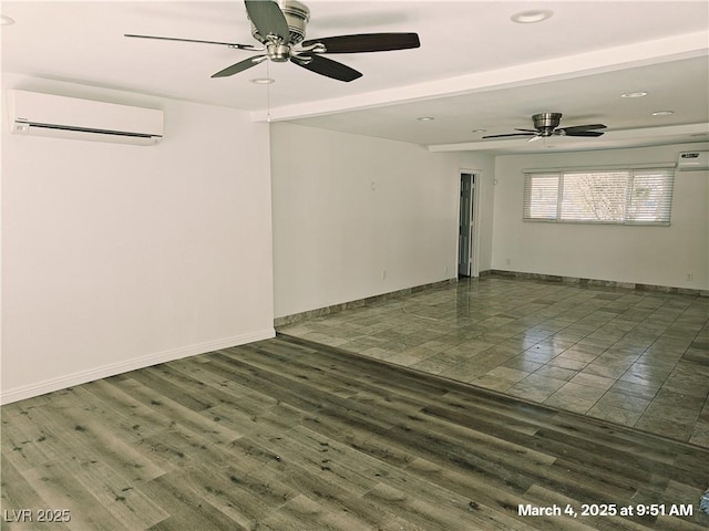 unfurnished room with ceiling fan, baseboards, wood finished floors, and a wall mounted air conditioner