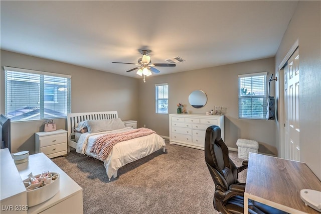 bedroom featuring a ceiling fan, carpet, a closet, and visible vents