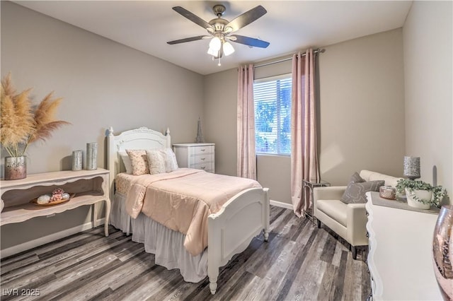 bedroom featuring ceiling fan, wood finished floors, and baseboards