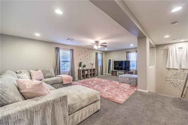 carpeted living area featuring a ceiling fan, recessed lighting, and visible vents