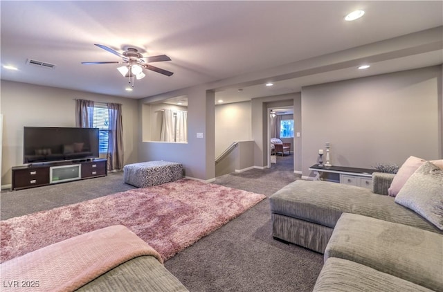 living room with carpet, visible vents, baseboards, and recessed lighting