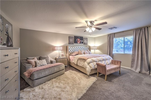 carpeted bedroom with ceiling fan, visible vents, and a textured ceiling