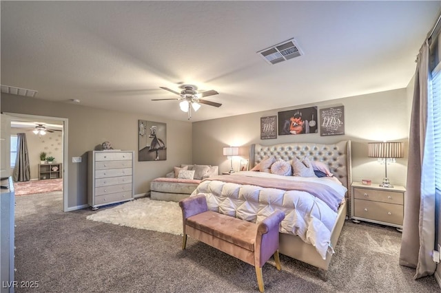 carpeted bedroom with ceiling fan, visible vents, and baseboards