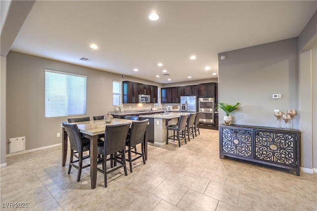 dining room featuring light tile patterned floors, recessed lighting, visible vents, and baseboards