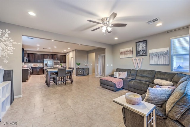 living room with ceiling fan, baseboards, visible vents, and recessed lighting