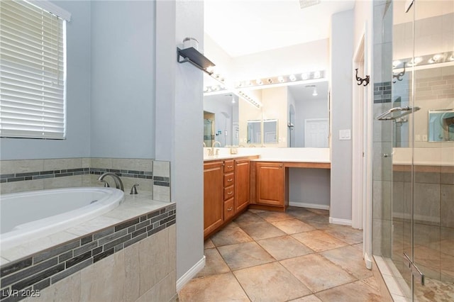 full bathroom with a shower stall, a bath, and vanity