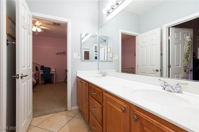 full bathroom with double vanity, visible vents, a sink, and tile patterned floors