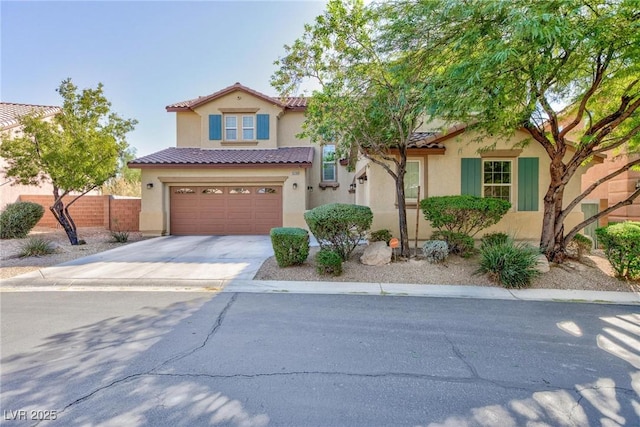 mediterranean / spanish-style house with a garage, a tile roof, fence, concrete driveway, and stucco siding