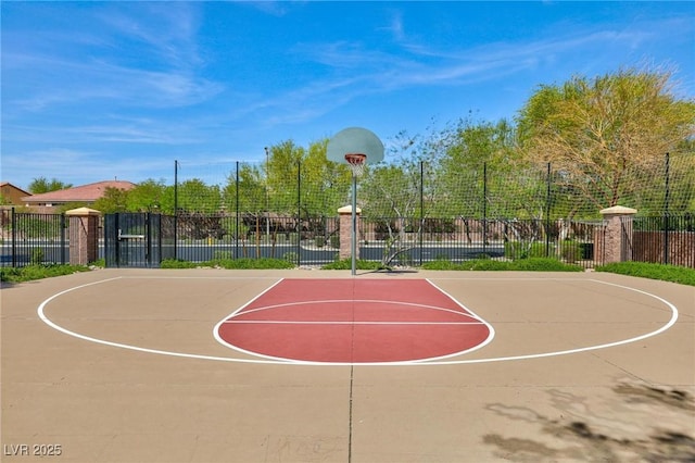 view of basketball court featuring community basketball court and fence