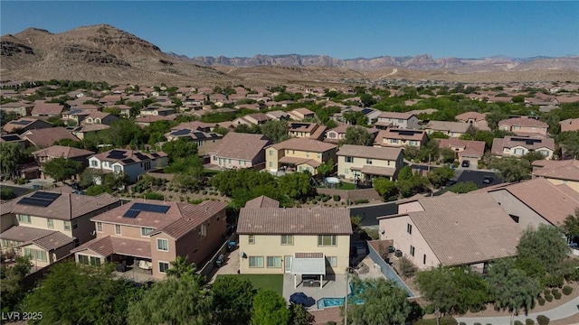 drone / aerial view with a residential view and a mountain view