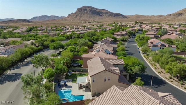 birds eye view of property with a mountain view and a residential view