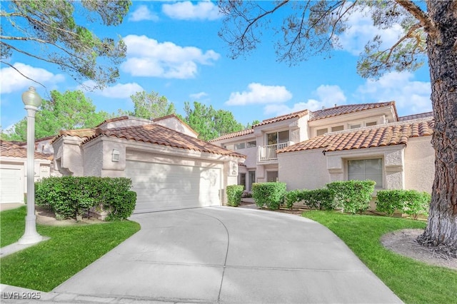 mediterranean / spanish-style house featuring a garage, concrete driveway, a tiled roof, and stucco siding