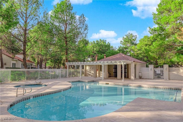 pool with fence, a pergola, and a patio