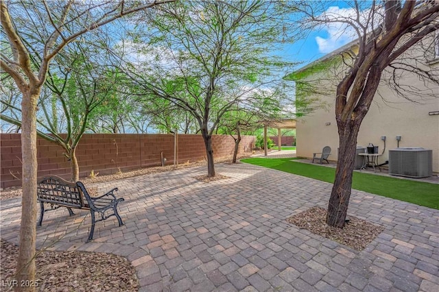 view of patio featuring a fenced backyard and central air condition unit