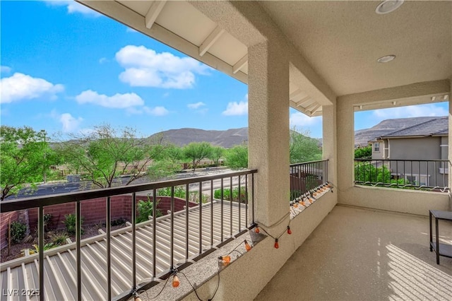 balcony featuring a mountain view