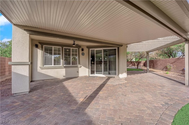 view of patio featuring a fenced backyard and a ceiling fan