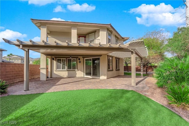 back of house with a patio, stucco siding, fence, a balcony, and a pergola