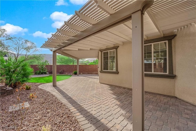 view of patio / terrace with fence and a pergola