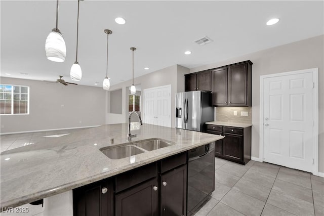 kitchen with stainless steel refrigerator with ice dispenser, visible vents, a sink, dark brown cabinets, and dishwasher