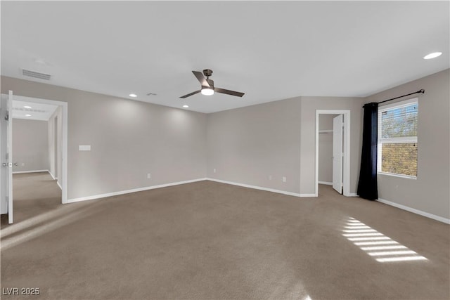 carpeted spare room with ceiling fan, recessed lighting, visible vents, and baseboards