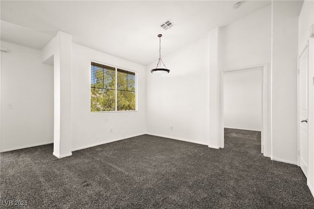 unfurnished dining area featuring lofted ceiling, baseboards, visible vents, and dark colored carpet