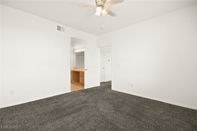 unfurnished bedroom with carpet floors, baseboards, visible vents, and ceiling fan