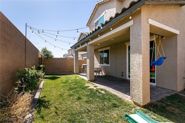 view of yard with a fenced backyard and a patio