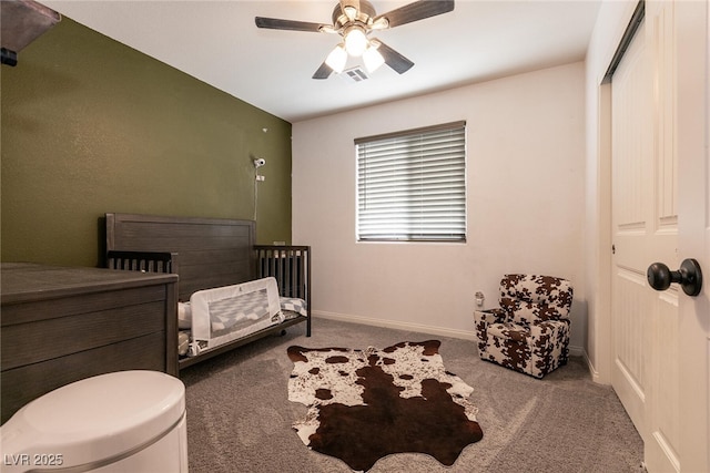 bedroom with ceiling fan, carpet flooring, and baseboards