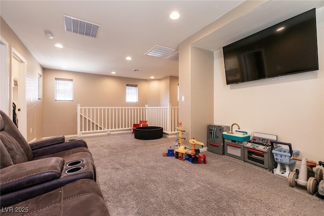 recreation room featuring recessed lighting, baseboards, visible vents, and carpet flooring