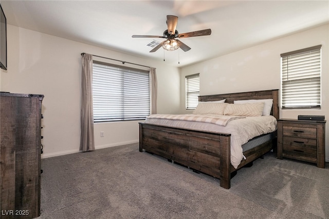 carpeted bedroom with a ceiling fan, visible vents, and baseboards