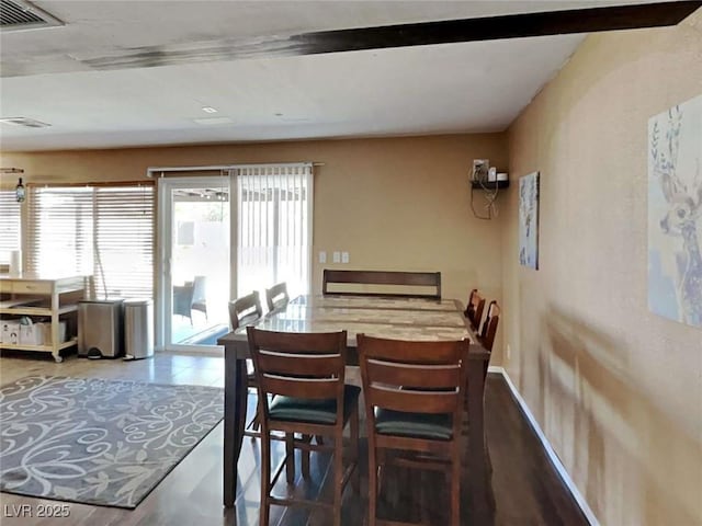 dining room with visible vents and baseboards