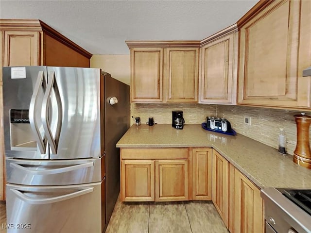 kitchen with tasteful backsplash and stainless steel fridge with ice dispenser