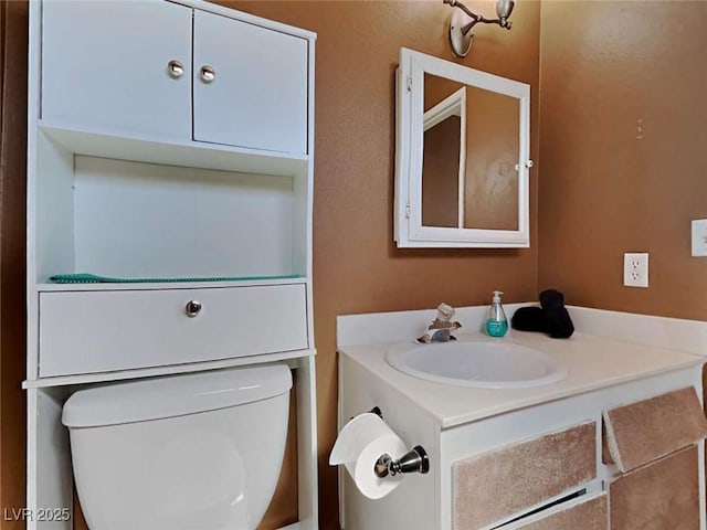 half bath featuring toilet and vanity