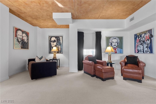 sitting room featuring carpet, visible vents, and baseboards