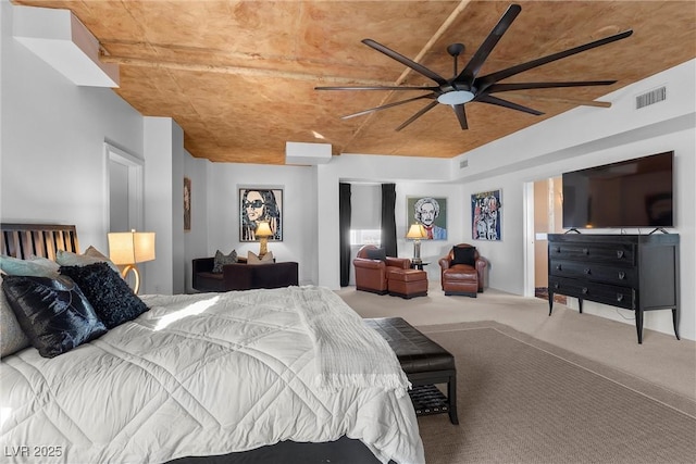 bedroom featuring carpet flooring, ceiling fan, and visible vents