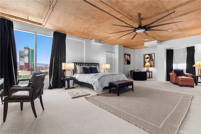 bedroom featuring a ceiling fan and carpet