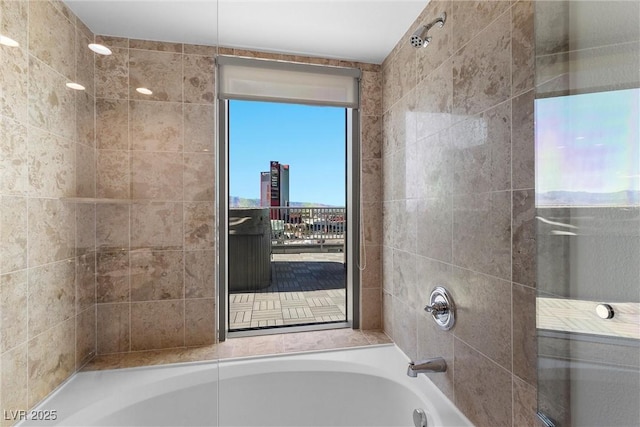 full bathroom with a view of city and shower / bath combination