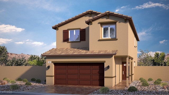 view of front of property featuring decorative driveway, an attached garage, fence, and stucco siding