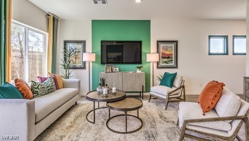 living room with visible vents and recessed lighting