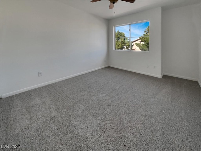 empty room featuring a ceiling fan, carpet flooring, and baseboards