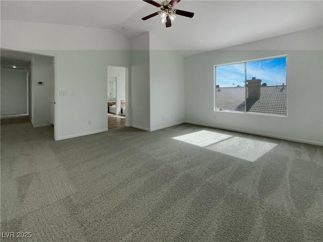 unfurnished bedroom featuring a ceiling fan, carpet flooring, vaulted ceiling, and baseboards