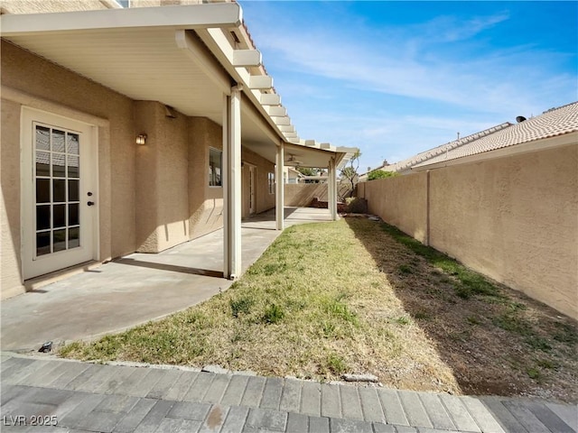 view of yard with a patio area and a fenced backyard